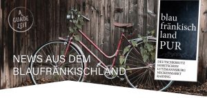 Fahrrad an Holzschuppen